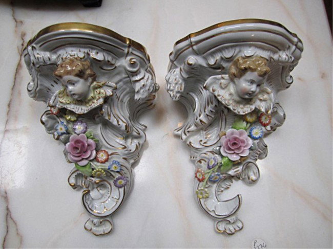 (M635) PAIR OF CHERUB WALL BRACKETS: Circa 1900. In good condition.