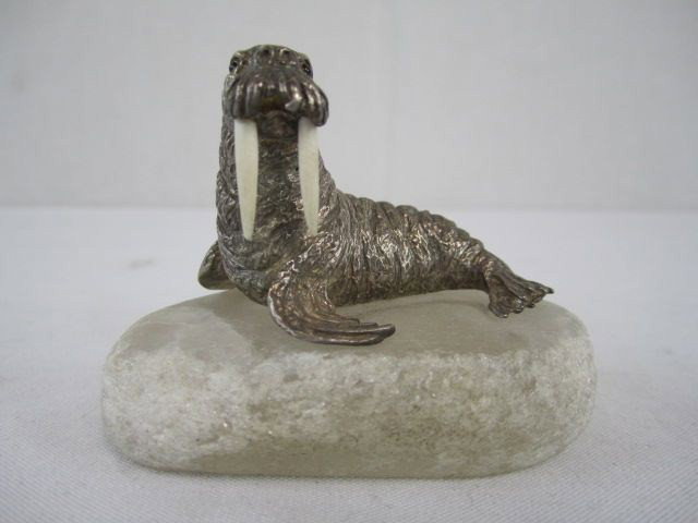 A47-10 RUSSIAN SILVER WALRUS WITH IVORY TUSK: In good condition. Measures 2 1/2" tall x 3" long.