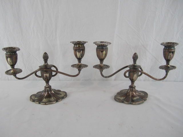 C65-4 PAIR OF ANTIQUE ENGLISH CANDELABRAS: Silver plate over copper with oval base. Large vase shaped candle holders. Good condition with showing some wear. Measures 9 1/2" tall x 14" wide. Estimate $400 - $800