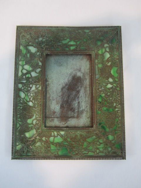 A44-19 RIVIERE GRAPEVINE FRAME: Signed on back "Riviere Studios New York". Good condition with small crack in front. Measures 11 1/2" x 9 1/2". Estimate $400 - $600