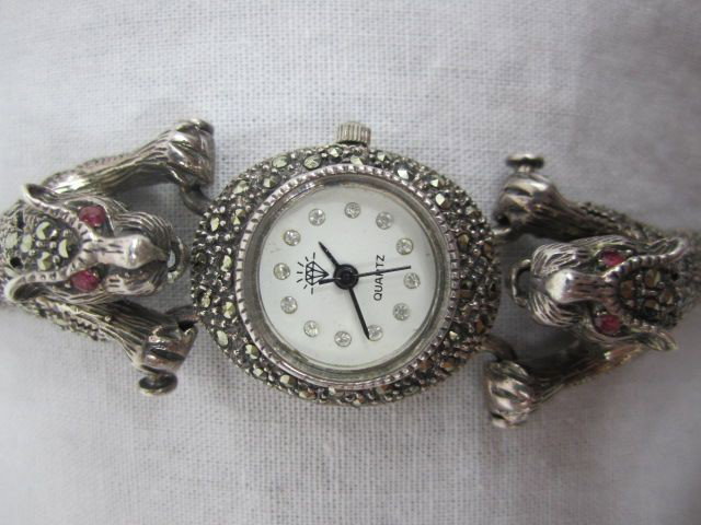 C99-1 MARCASITE WATCH: With two Panther heads around watch face. Good condition. Estimate $200 - $400