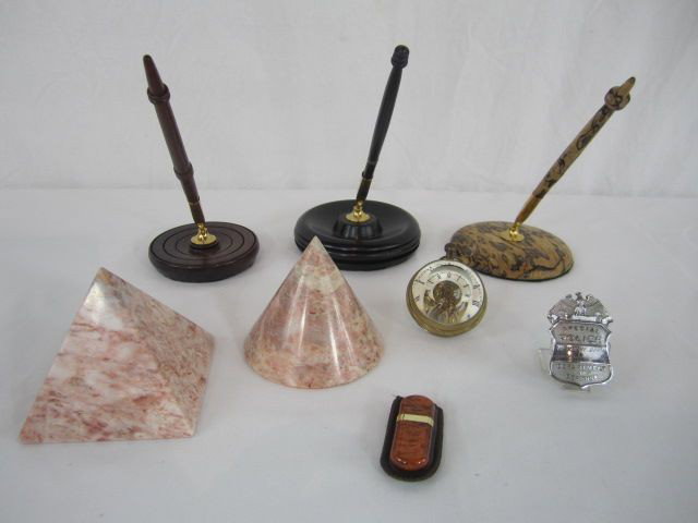 D43-4 LOT OF 6 ASSORTED ITEMS: Including 3 pen holders, badge, 2 marble paper weights, India clock and lighter. Estimate $20 - $40