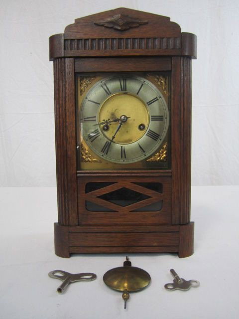 A3-3 WALL CLOCK: Measures 14 3/4" tall x 9" wide. Estimate $50 - $100