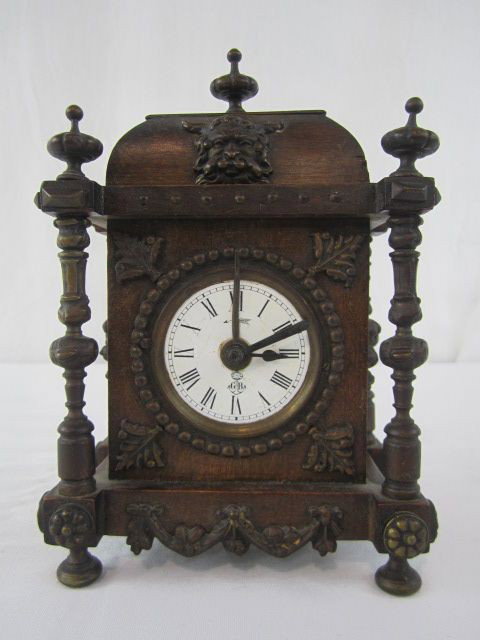 A45-17 RARE GUSTAV BECKER WALNUT MINIATURE CLOCK: Measures 8 1/2" tall. Estimate $800 - $1,000