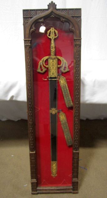 D44-1 EL CID TIZONA TOLEDO SPANISH SWORD: Reproduction of a sword belonging to Castilian Knight Rodrigo Diaz de Vivar, known as "El Cid Campeador" in the 11th Century. Measures 45 1/2" tall x 12" wide with case. Estimate $500 - $1,000