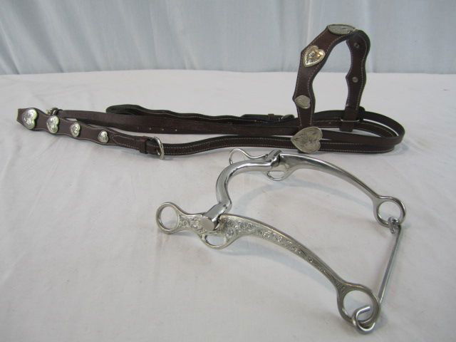 D30-1 EDWARD H. BOHLIN STERLING BIT & BRIDAL: Sterling bit is signed Edward Bohlin. Total weight of bit 447.7 grams. Leather bridle has silver conchos and is not Edward Bohlin. Total weight of conchos 81.6 grams. Estimate $800 - $1,200