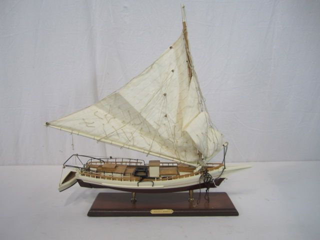C98-22 WILLIE L. BENNETT WOODEN MODEL SAIL BOAT: Measures 21" tall x 21" long. Estimate $100 - $300
