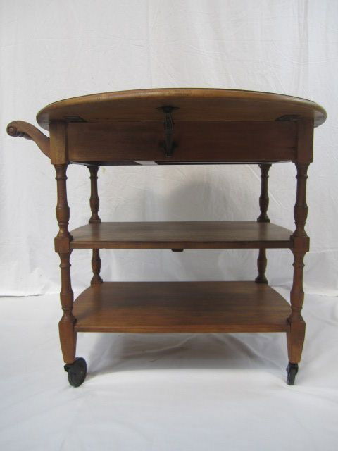 C80-12 PENNSYLVANIA HOUSE MAPLE 1950's TEA CART: With drawer and drop leaf sides. Measures 28" tall x 32" wide. Estimate $100 - $300