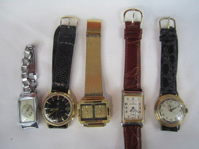 C78-12 LOT OF 5 ASSORTED WATCHES: Including Bulova Accutron with date gold filled and black face, Pulsar Dual Time, Jaecer le Coultre Fake Reverso watch, Pierce waterproof, and 1920's Roxy with band. Estimate $300 - $600