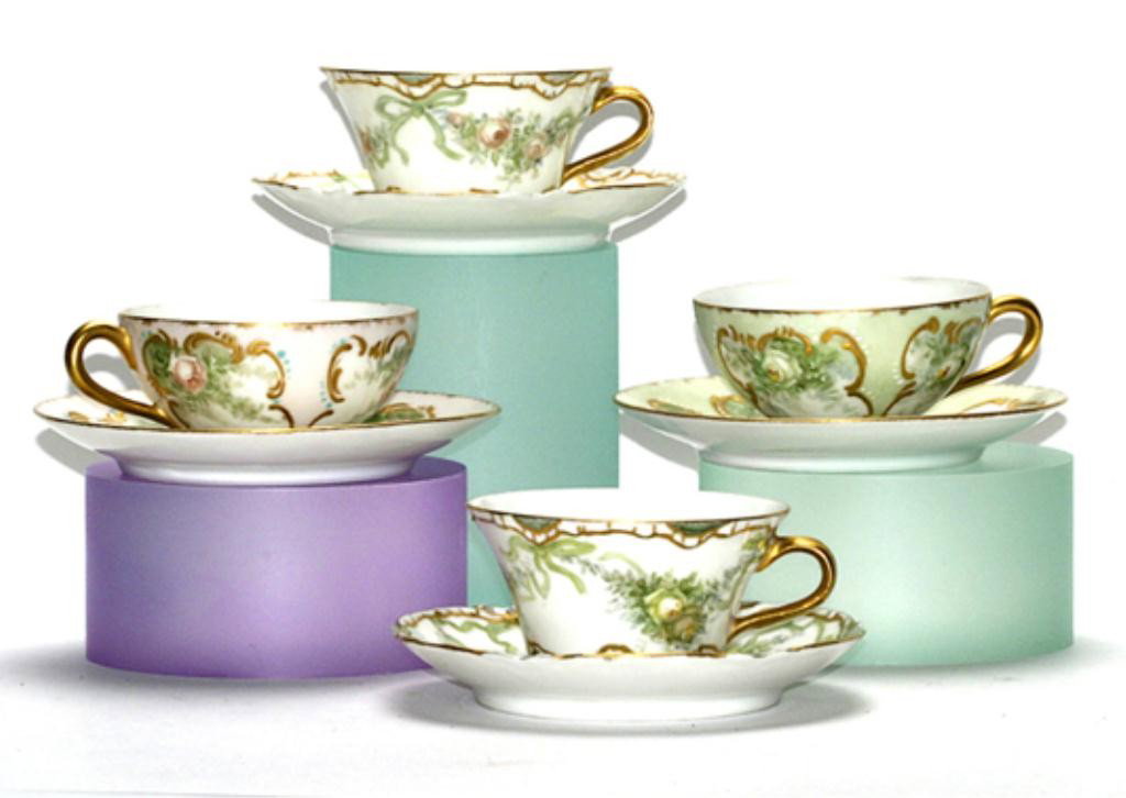 F60-239 HAVILAND & T&V LIMOGES CUPS & SAUCERS: Hand painted and gilt, 4 cups and 4 saucers and hand painted with beautiful flowers and gilt. Cups measure 2" tall and saucers 5" diameter. Estimate $100 - $300
