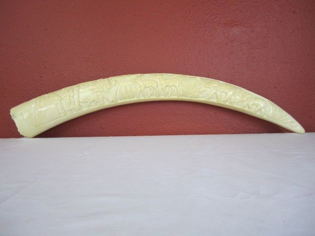 D88-2 AFRICAN IVORY CARVED ELEPHANT TUSK: Measures 34" long. Estimate $200 - $300