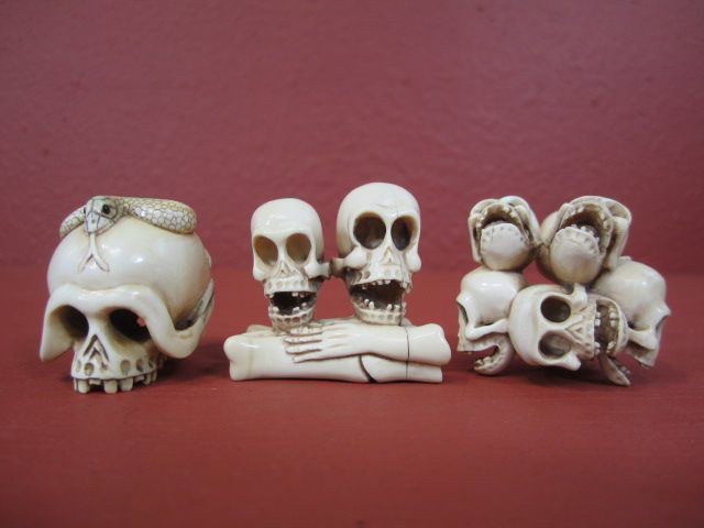 F27-34 LOT OF 3 CARVED IVORY NETSUKE SKULLS: Largest measures 1 3/4" tall. Estimate $100 - $300