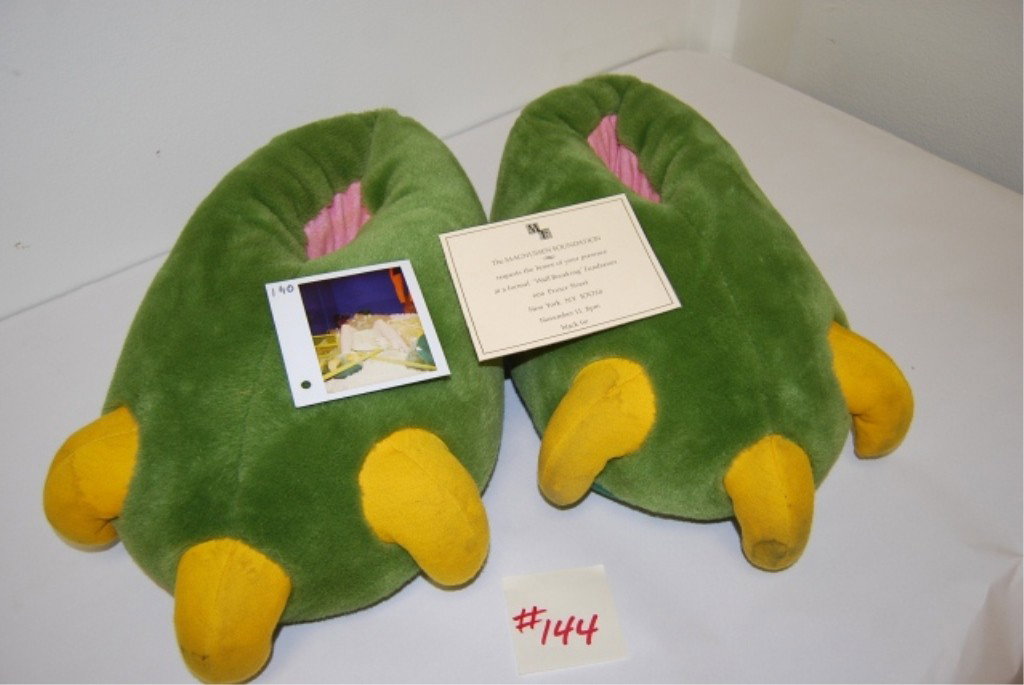 THE RUNESTONE MOVIE PROP "GODZILLA FEET" PLUS: Godzilla feet slippers have some minor soiling from normal use. Includes photograph showing movie use. Includes prop invitation for wall breaking party with photo of party in film.