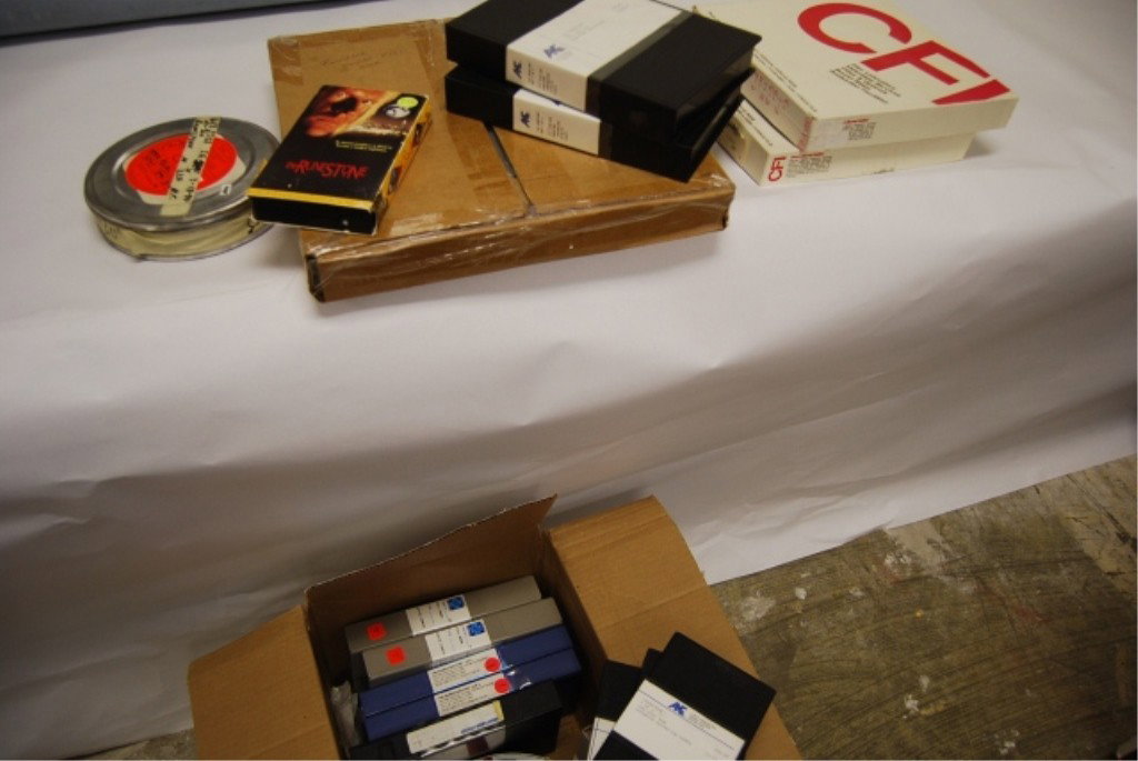 BOX OF FILM & VIDEO OF THE RUNESTONE: Includes 5 Reels of 35mm film, 8 production video cassettes, and 3 VHS video cassettes.