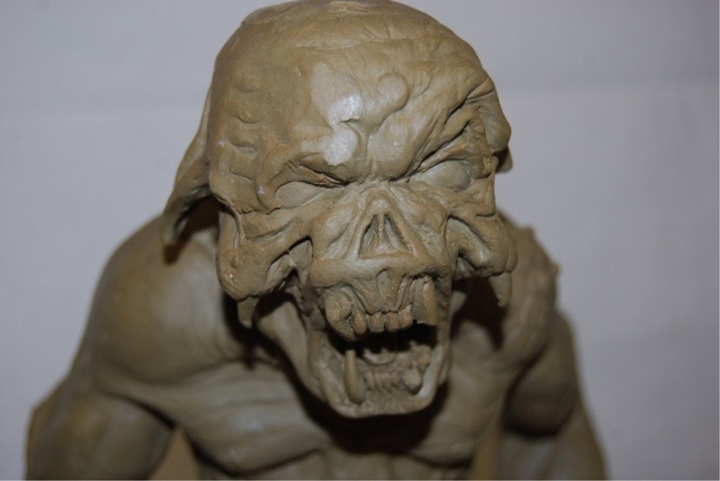 THE RUNESTONE CLAY SCULPTURE CONCEPT MODEL: Measures 19" tall on 4-¼" wood base. Some damage.