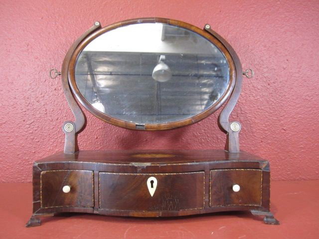 F64-7 ART DECO TABLETOP INLAID VANITY WITH MIRROR: Circa 1830s - 1840s. With key. Fair condition with some minor damage due to age. Measures 6 1/4" tall x 16" wide x 6 3/4" deep. Estimate $100 - $300