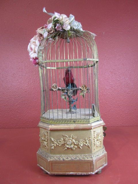 A22-10 FRENCH MECHANICAL COIN OPERATED BIRDCAGE: Rare circa 1890. This beautiful piece will work on American nickels which go into a slot and fall into a drawer on the side of the base. The bird sings and the head and tail move. The bellows are slig