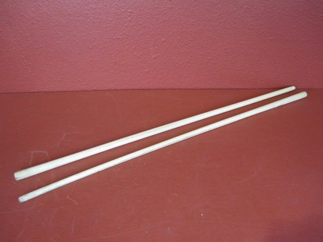 F69-3 LOT OF 2 ALASKAN WALKING STICKS: Both sticks made of bone. Used as walking sticks, snow probes or dance wands. Measures 36" long. Estimate $100 - $300