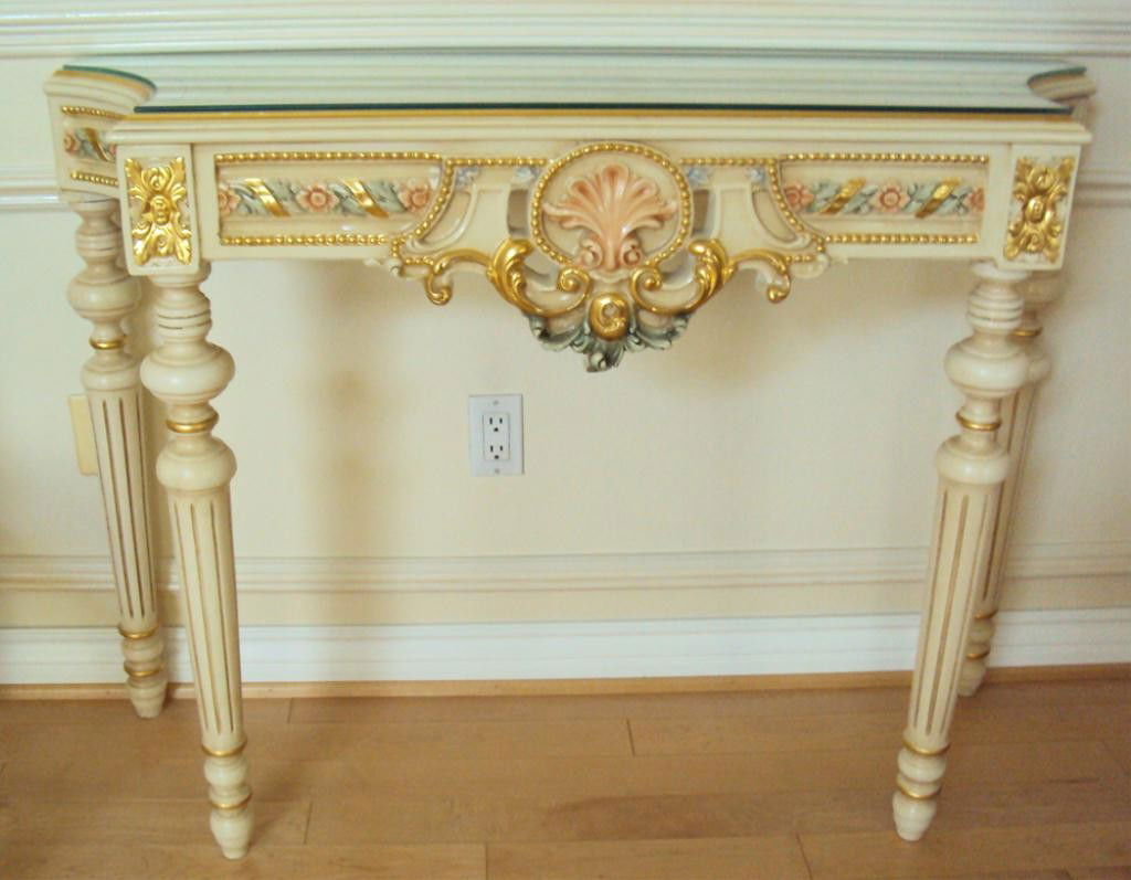 F60-335 HAND PAINTED CONSOLE TABLE: Ivory color with colorful flowers carved and painted. Estimate $400 - $800