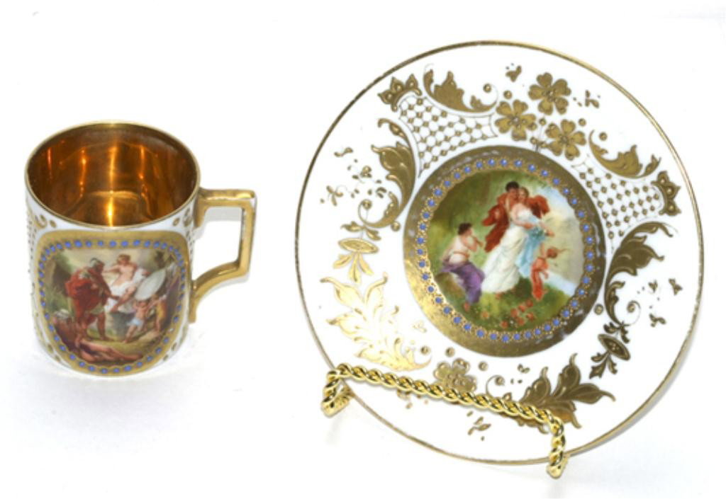 F60-152 ROYAL VIENNA CUP & SAUCER: Marked on bottom. Cup measures 2 1/2" tall and saucer 5" diameter. Estimate $300 - $600