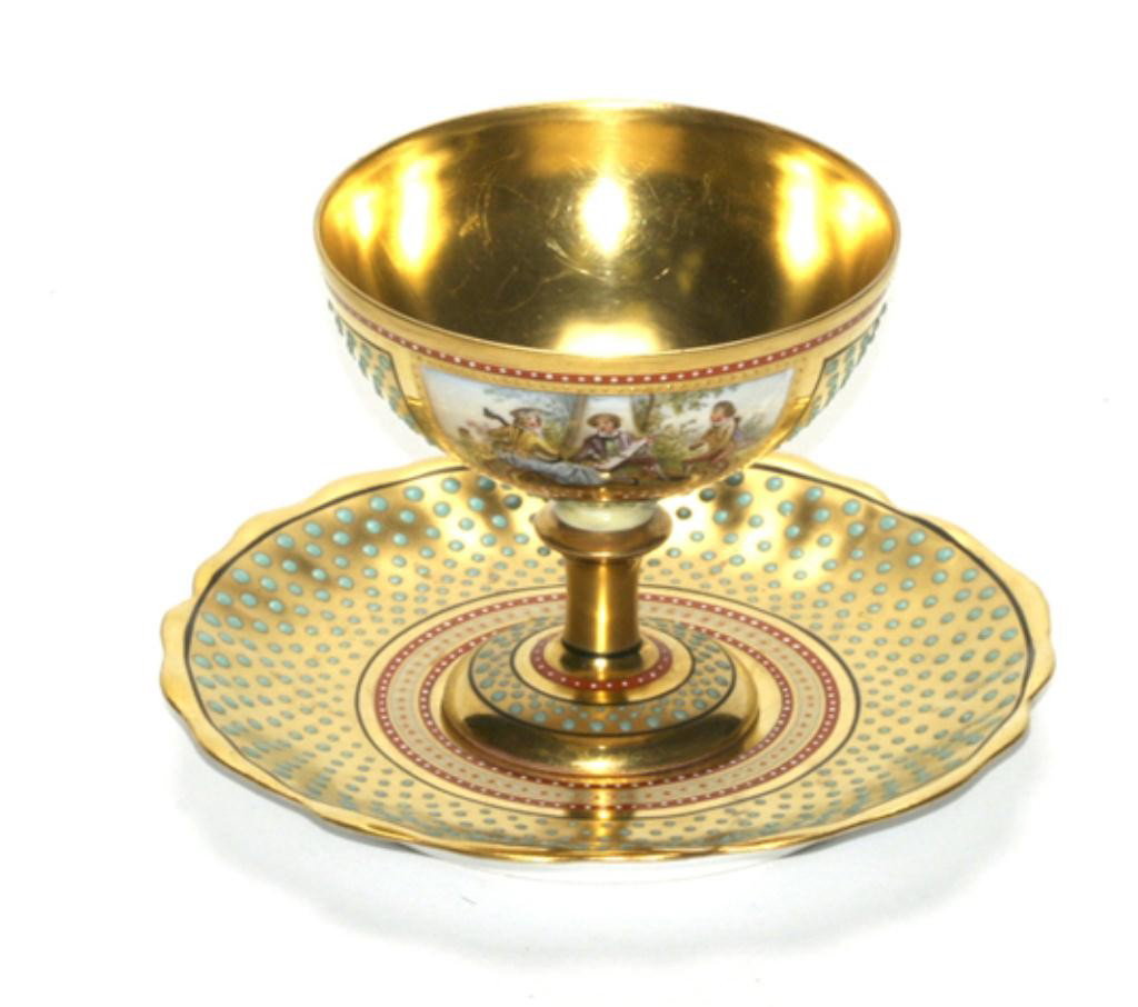 F60-162 DRESDEN CUP & SAUCER: Hand painted porcelain cup measures 3" tall and saucer 5" diameter. Estimate $400 - $800