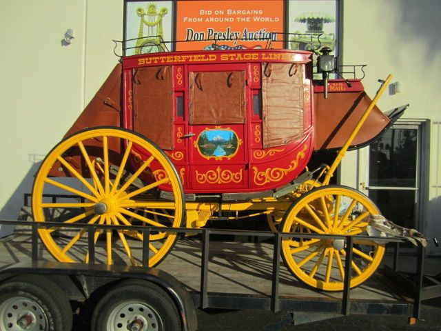 G14-1 BUTTERFIELD STAGECOACH: 3/4 size, leather slung with barrel sides, red velvet interior, made around 1942 for use in parades, rodeos, etc. Comes with pole and double tree, waterproof cover, and kids center seat. Has original