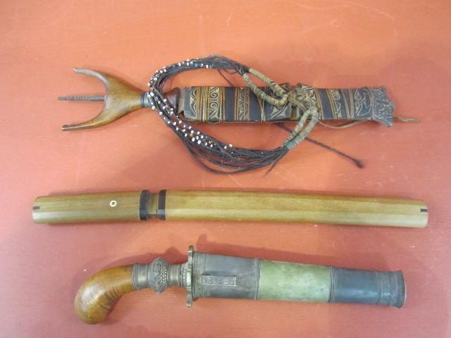 A3-8 TWO ANTIQUE DAGGERS & 1 JAPANESE KNIFE: Including dagger with wooden handle and metal sheath, Native dagger with wooden sheath, and Japanese knife with sheath. Longest measures 14 1/2" . Estimate $100 - $300