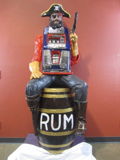 G45-2 PIRATE ON BARREL $1.00 SLOT MACHINE: Originally made by John Taylor in the 1960s. Measures 74" tall x 27 1/2" wide x 25" deep. Estimate $4,500 - $6,500