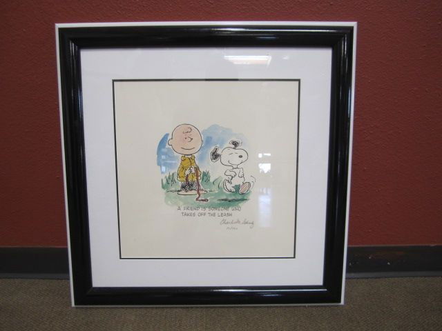 F51-6 SIGNED "CHARLES M. SCHULZ" PRINT: Numbered 75/500. Measures 27" x 27" with frame. Estimate $200 - $500