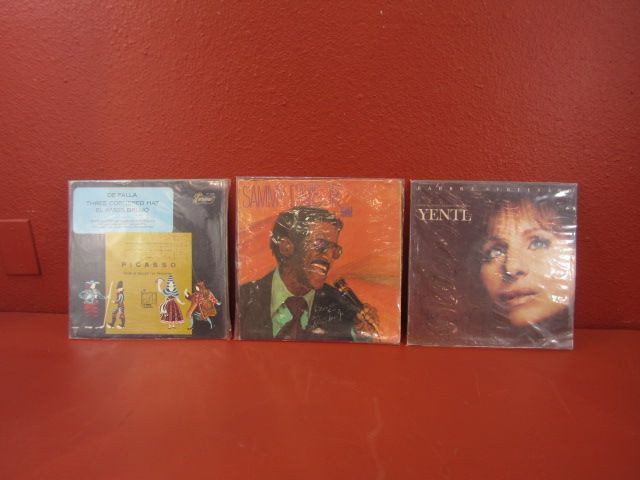 G30-1 LOT OF 3 AUTOGRAPHED ALBUM COVERS & ALBUMS: Including Barbra Streisand, Sammy David Jr., and Picasso autographed album covers. Estimate $50 - $150