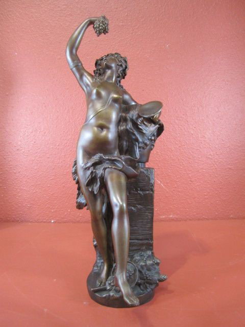 A31-2 SIGNED "MOREAU" BRONZE FIGURINE: "Lady with Grapes" Circa 1940s. Measures 20 1/2" tall. Estimate $900 - $1,500