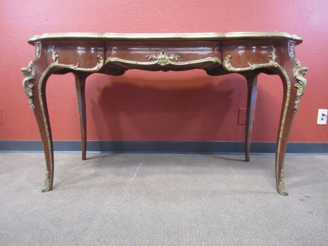A11-8 LEATHER TOP DESK: With bronze ormolu. 19th century. Measures 30" tall x 54" wide x 28 1/2" deep. Estimate $4,500 - $5,500
