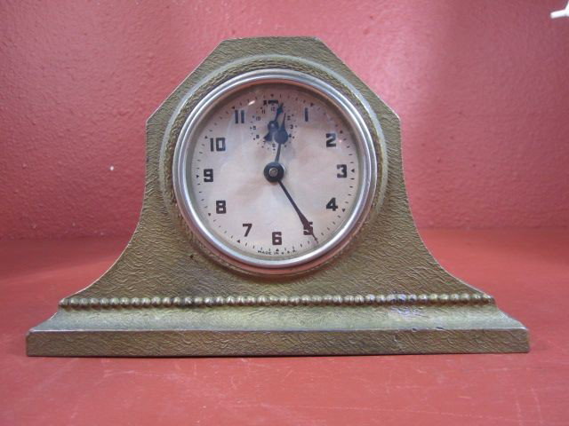 A71-10 METAL COIN BANK CLOCK: Measures 6" tall x 9" wide. Estimate $100 - $200