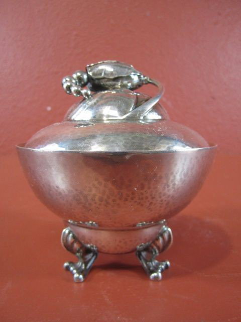 A45-11 GEORG JENSEN STERLING SUGAR BOWL: Blossom pattern. Total weight 8.03 troy ounces. Measures 4 1/2" tall.