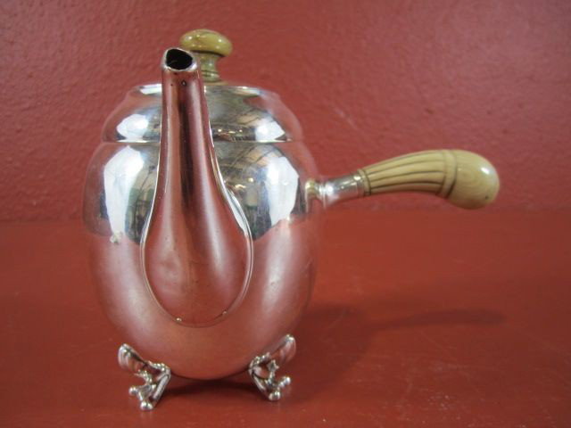 A45-13 GEORG JENSEN STERLING TEAPOT: Total weight with handles 10.18 troy ounces. Measures 6" tall.