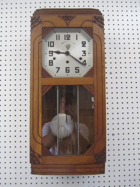 E40-4 ANTIQUE WALL CLOCK: Face reads "Veritable Westminster". Measures 26 1/2" tall x 12" wide. Estimate $200 - $500