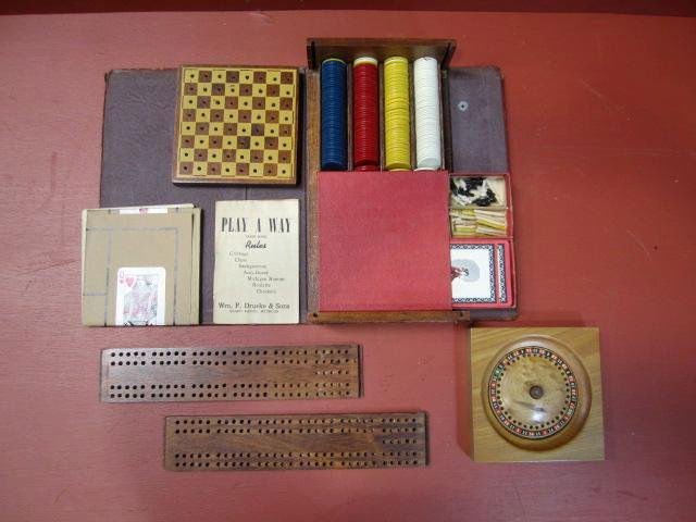 F86-3 WM. F. DRUEKE & SONS "PLAY A WAY" GAMES: Includes; Cribbage, Chess, Backgammon, Acey-Ducey, Michigan Rummy, Roulette, and Checkers. Comes with original rule book, chips and cards. Estimate $100 - $200