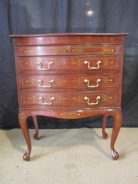 A3-4 BRASS INLAID SILVER CHEST: With top compartment and three drawers all with green velvet lining and key. Measures 33" tall x 27 1/2" wide x 14" deep. Estimate $200 - $500