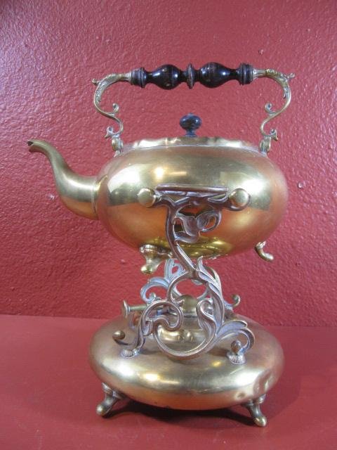 A65-5 ANTIQUE BRASS TIPPING TEAPOT: Complete with burner. Circa 1900. Measures 12" tall. Estimate $200 - $400 Starting Bid $50