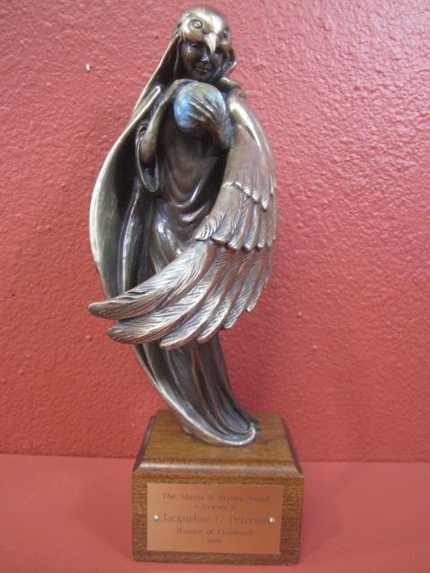 G21-10 SIGNED "SARGENT 17/19" BRONZE TROPHY: Holding th world. Great patina. Label reads "The Alteria M Bryant award is Presented to Jacqueline G. Peterson Women of Excellence 1999". Measures 15" tall. Estimate $200 - $400 Starting Bid $100