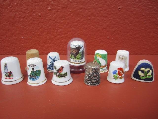 E77-8 VINTAGE THIMBLE COLLECTION: Total of eleven assorted thimbles. Estimate $40 - $80 Starting Bid $10