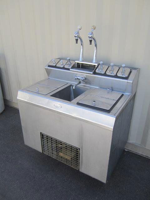 E87-48 EVERFROST SODA SHOP ICE CREAM FOUNTAIN: Circa 1940 - 1950's Stainless steel and chrome with alabaster knobs with ceramic flavor inserts. Comes with motor. Measures 59" tall x 42" wide x 39" deep. Estimate $800 - $1,500 Starting Bid $200