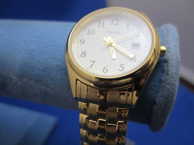 A27-10 LADIIES PULSAR QUARTZ WATCH: One brand new ladies gold plated pulsar quartz watch. Estimate $50 - $100 Starting Bid $20
