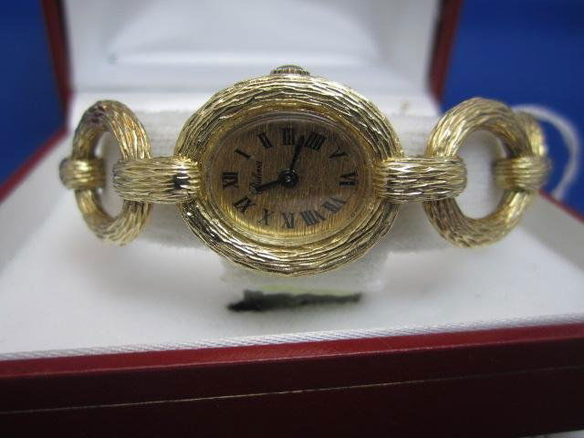 A27-17 LADIES BULOVA WATCH: One beautiful bark finished yellow gold ladies Bulova watch with original working manual Swiss movement(tw 52.65gms). Estimate $3,000 - $4,000 Starting Bid $1,600