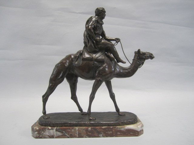 G90-59 ARAB RIDING A CAMEL BRONZE: Signed C. Valton. 19th century. Measures 14 1/2" tall. Estimate $1,000 - $2,500 Starting Bid $500