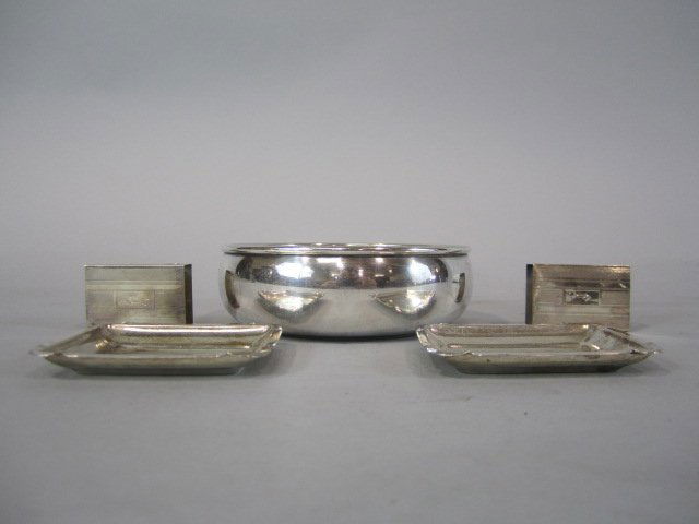 H32-11 GROUP OF 5 STERLING SILVER ITEMS: Two match holders 1 3/4" x 1", two trays 2 3/4" x 2 1/4", and bowl 6" diameter. Total weight 4.6 troy ounces. Estimate $100 - $300 Starting Bid $50