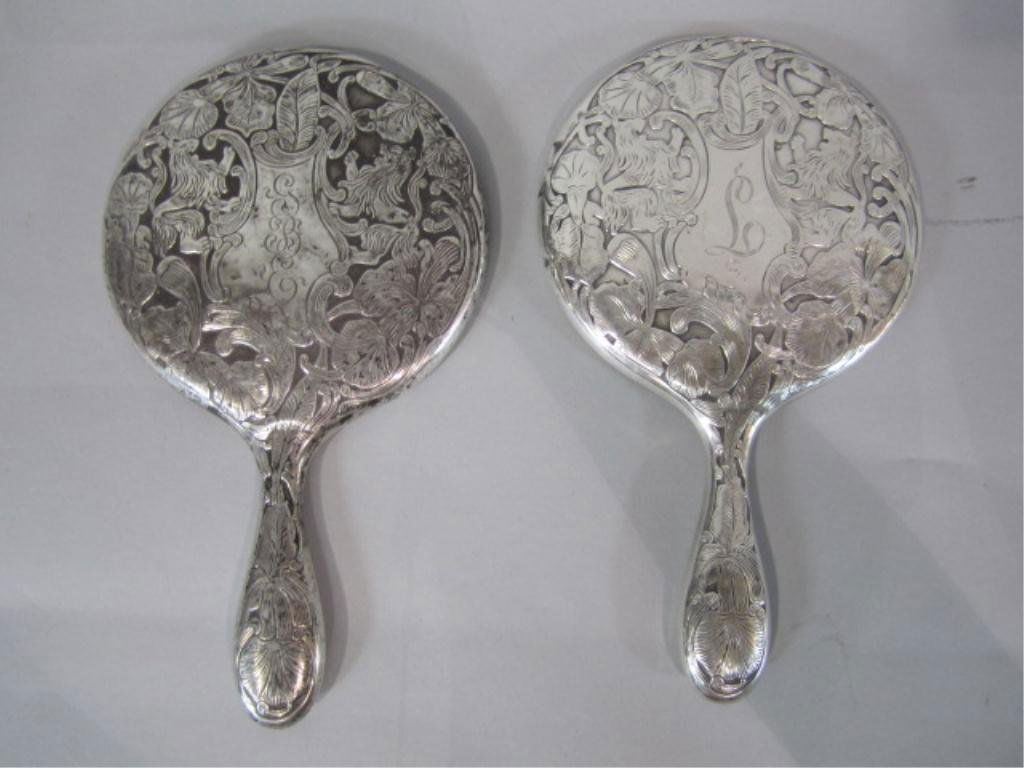 A4-17 MATCHING STERLING SILVER HAND MIRRORS: With lion motif. Measures 9 1/2" long. Estimate $200 - $300 Starting Bid $50