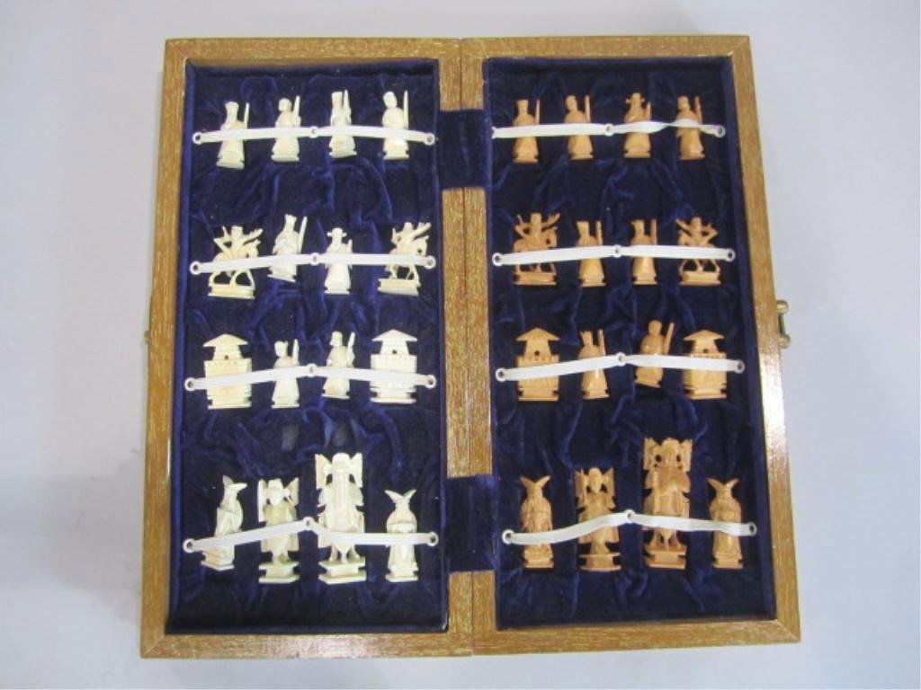 A27-29 CHINESE CARVED IVORY CHESS SET: Board measures 13" x 13". Tallest ivory piece measures 2 1/2"tall.