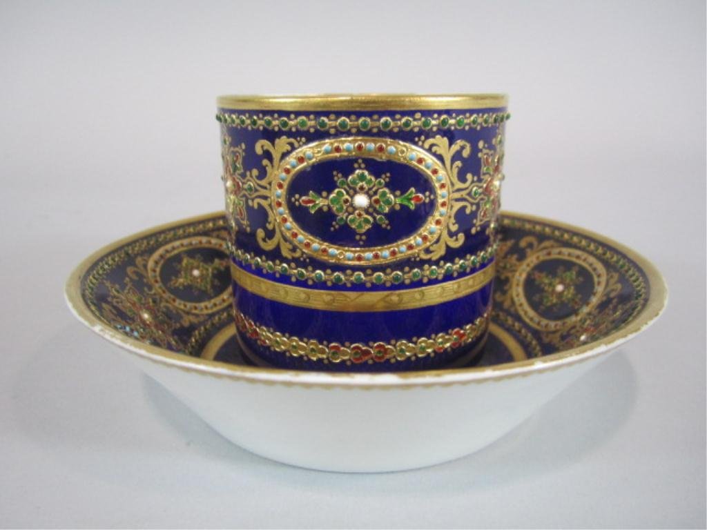 H63-4 SEVRES PORCELAIN CUP & SAUCER: With jewels. Cup measures 2 1/2" tall and saucer 5 3/8" diameter. Estimate $200 - $400 Starting Bid $100