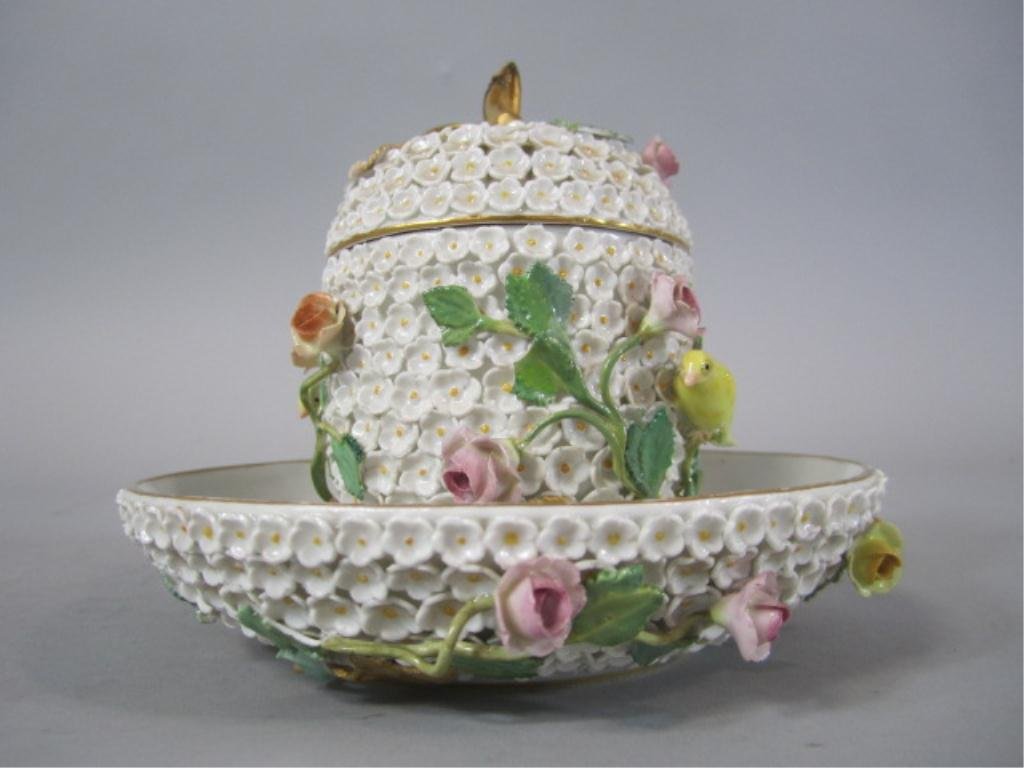 H63-9 MEISSEN PORCELAIN CUP & SAUCER: With lid. Cup has been repaired in several areas. Cup measures 5 1/2" tall and saucer 5 3/4" diameter. Estimate $200 - $400 Starting Bid $100